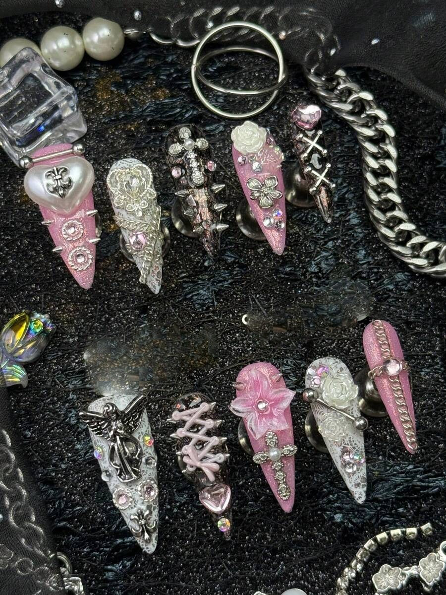 Sweet Sinner stiletto nails with angel charm, corset lacing and 3D flower