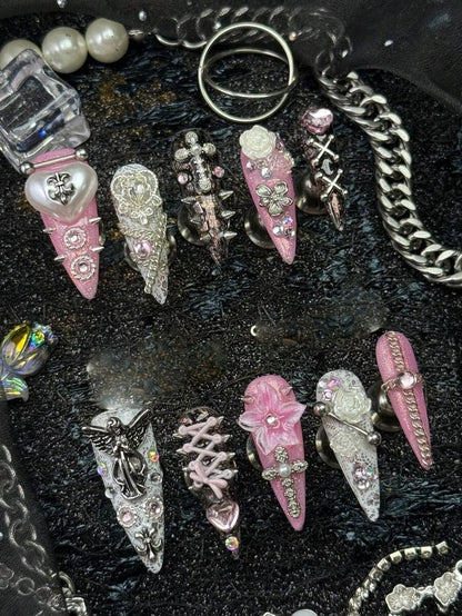 Sweet Sinner stiletto nails with angel charm, corset lacing and 3D flower