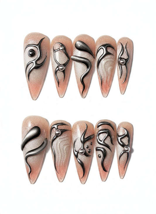 Quicksilver Venom long stiletto press on nails in nude shimmer with silver chrome swirls