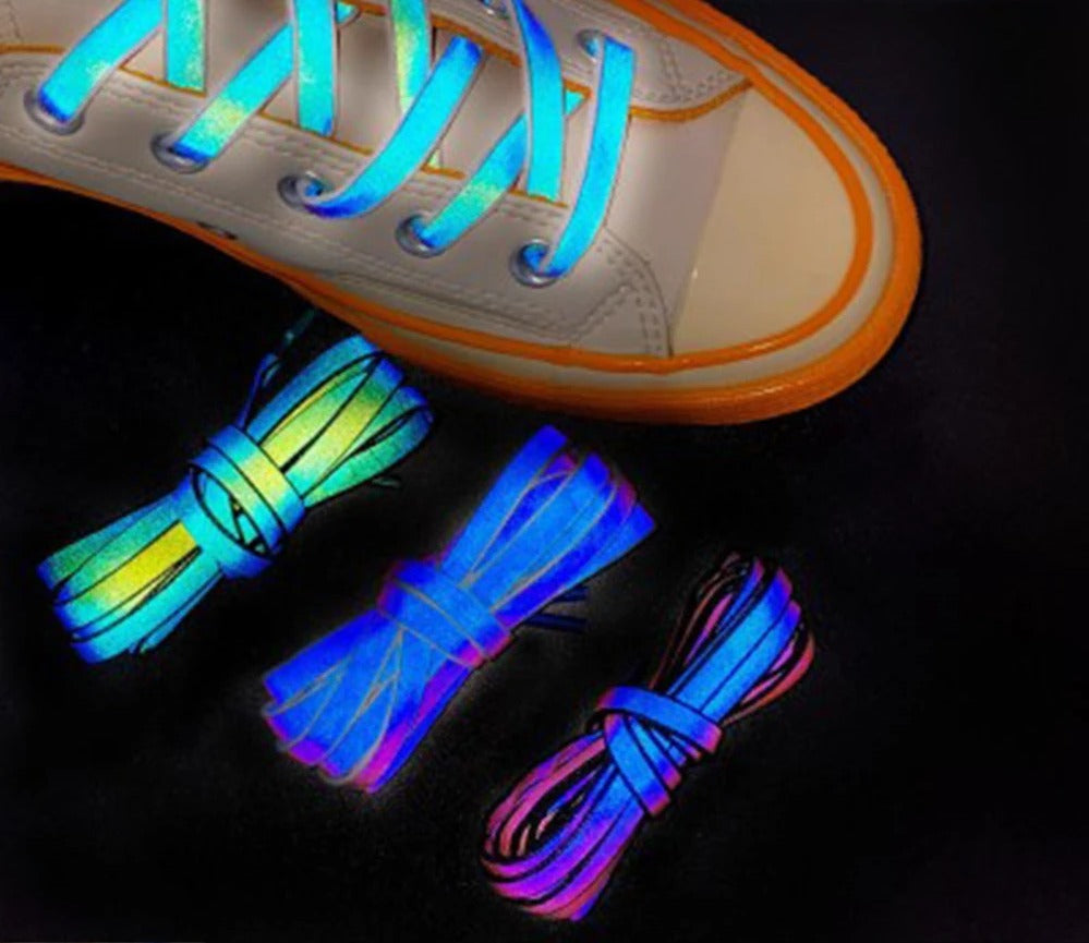 Reflective laces glowing in white high-top sneakers