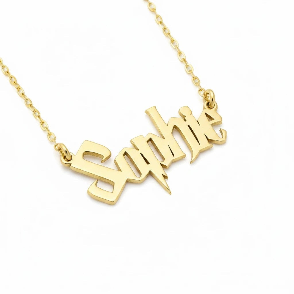 Molliwater gold tone custom name necklace featuring wizarding-world inspired lettering on a delicate chain.