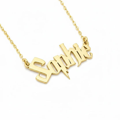 Molliwater gold tone custom name necklace featuring wizarding-world inspired lettering on a delicate chain.